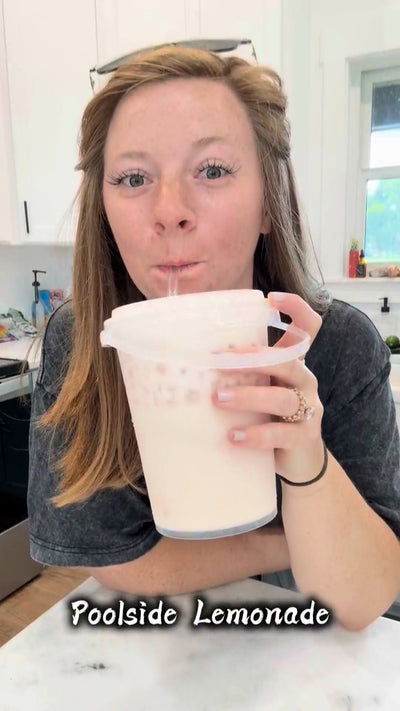 Gallery image 3: Person holding a cup of lemonade with 'Poolside Lemonade' text in a kitchen setting