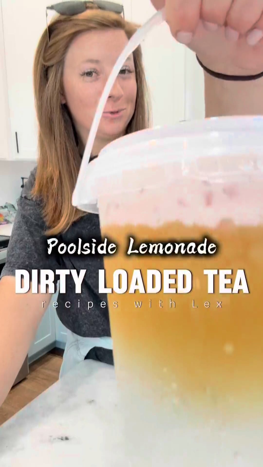Load video: Person pouring a drink labeled 'Poolside Lemonade Dirty Loaded Tea' with text overlay.