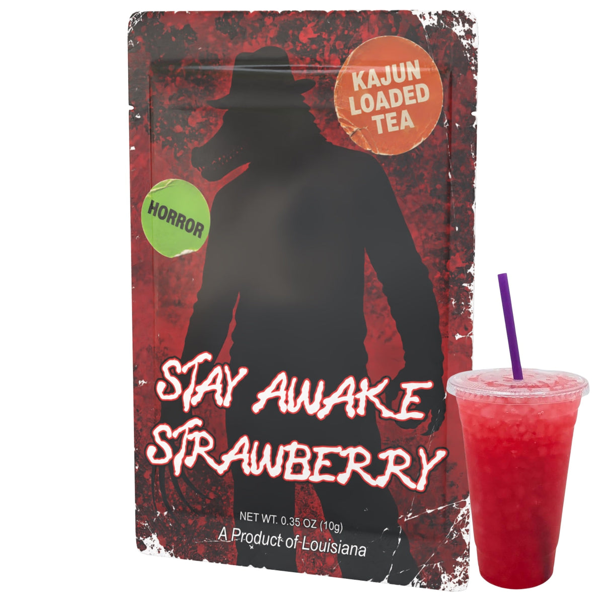 A packet of 'Stay Awake Strawberry' loaded tea mix by Kajun Loaded Tea, shown next to a clear plastic cup filled with a red beverage and a purple straw. The pouch features a distressed red and black design with a silhouette of a figure in a hat, a green 'Horror' sticker, and an orange 'Kajun Loaded Tea' logo.